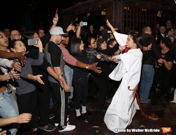 Catherine Ricafort does the ceremonial three laps around the stage. Photo by Walter McBride.